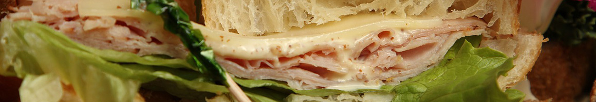 Eating Deli Sandwich at Groucho's Deli restaurant in Columbia, SC.
